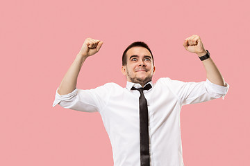 Image showing Winning success man happy ecstatic celebrating being a winner. Dynamic energetic image of male model