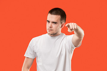 Image showing The overbearing businessman point you and want you, half length closeup portrait on orange background.