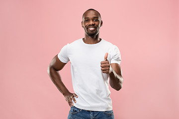 Image showing The happy businessman standing and smiling