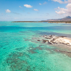 Image showing Aerial view of beautiful tropical beach with turquoise sea. Tropical vacation paradise destination of D\'eau Douce and Ile aux Cerfs Mauritius