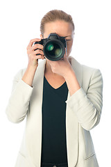 Image showing Beautiful young photographer with camera in professional studio