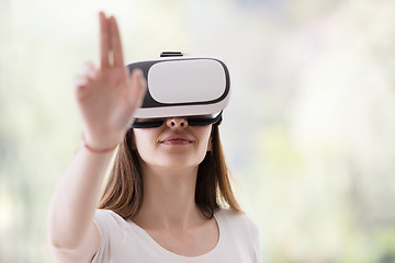 Image showing woman using VR-headset glasses of virtual reality