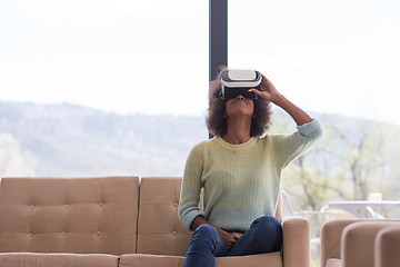 Image showing black woman using VR headset glasses of virtual reality