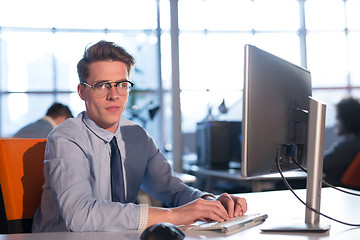 Image showing businessman working using a computer in startup office