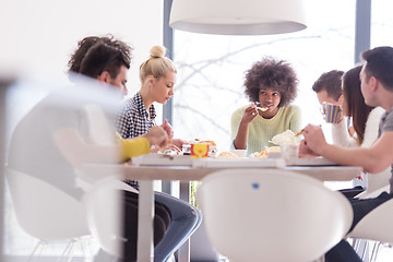 Image showing multiethnic group of happy friends lunch time