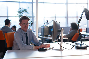 Image showing businessman working using a computer in startup office