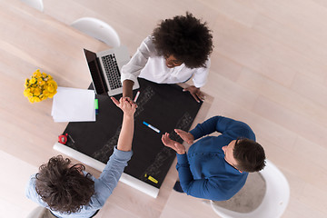 Image showing top view of Multiethnic startup business team on meeting