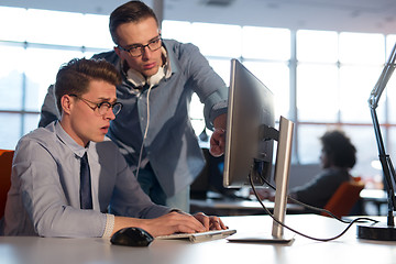 Image showing Two Business People Working With computer in office