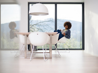 Image showing young African American woman in the living room