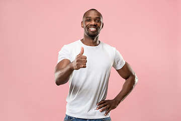 Image showing The happy businessman standing and smiling