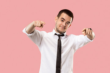 Image showing The overbearing businessman point you and want you, half length closeup portrait on pink background.
