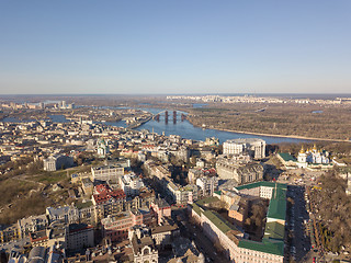 Image showing Kiev, Ukraine - April 7, 2018: Landscape view of the old district of Podol with the Vladimir Church and St. Andrew\'s Church against the blue sky