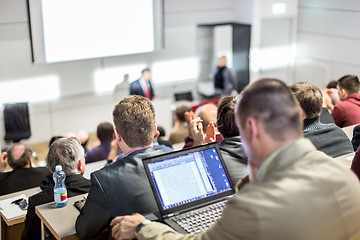 Image showing Business speaker giving a talk at business conference event.