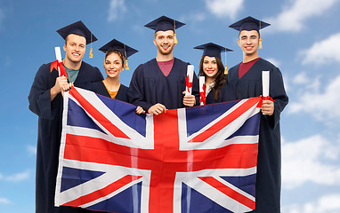 Image showing graduate students with diplomas and british flag