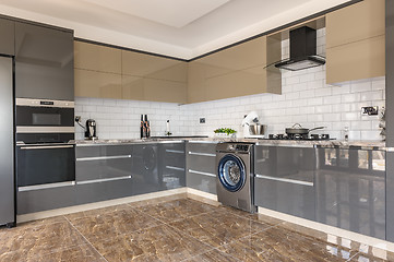 Image showing Luxury modern white, beige and grey kitchen interior