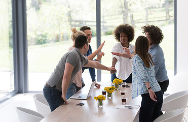 Image showing multiethnic startup Group of young business people celebrating s