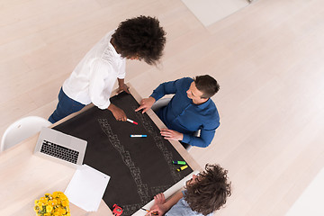 Image showing top view of Multiethnic startup business team on meeting