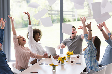 Image showing multiethnic startup Group of young business people throwing docu