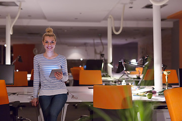 Image showing woman working on digital tablet in night office