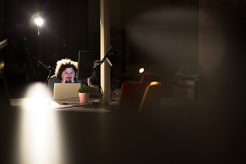 Image showing businessman relaxing at the desk