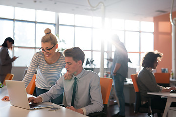 Image showing Two Business People Working With laptop in office