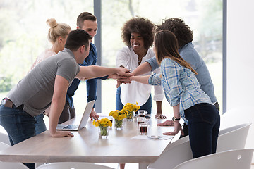 Image showing multiethnic startup Group of young business people celebrating s