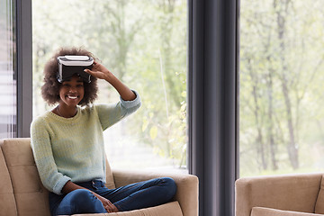 Image showing black woman using VR headset glasses of virtual reality