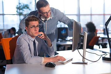 Image showing Two Business People Working With computer in office