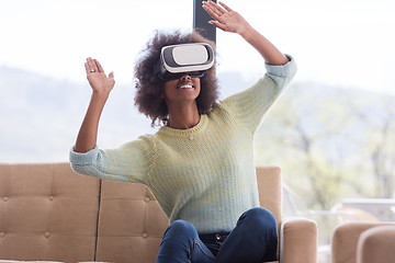 Image showing black woman using VR headset glasses of virtual reality