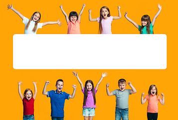Image showing Happy success teensl celebrating being a winner. Dynamic energetic image of happy children