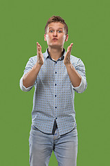 Image showing Portrait of attractive man with kiss isolated over green background