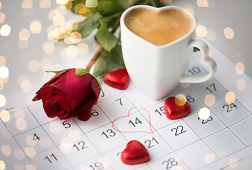 Image showing close up of calendar, hearts, coffee and red rose