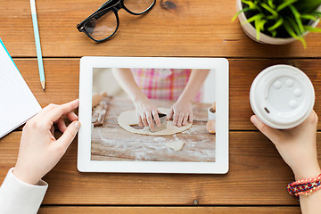 Image showing woman watching cooking video on tablet computer