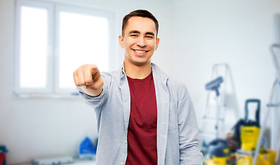 Image showing man pointing to you over home repair background