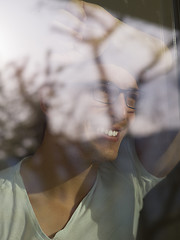 Image showing young man drinking morning coffee by the window