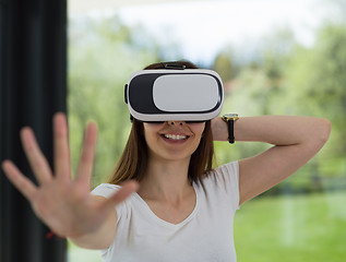 Image showing woman using VR-headset glasses of virtual reality