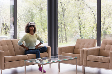 Image showing black woman using VR headset glasses of virtual reality