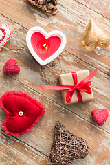 Image showing christmas gift, heart shaped decorations, candle