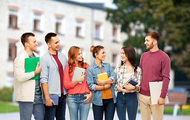 Image showing group of smiling students talking over campus