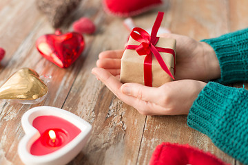 Image showing close up of hands holding christmas gift