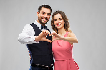 Image showing happy couple making hand heart on valentines day