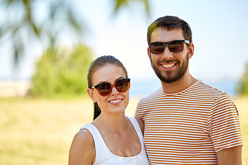 Image showing happy couple in sunglasses outdoors in summer