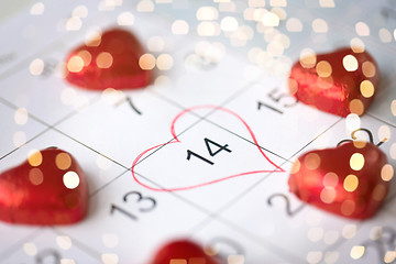 Image showing close up of calendar and heart shaped candies