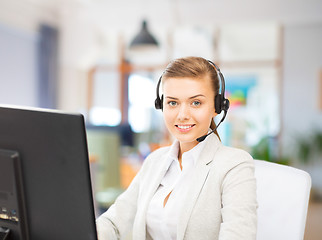 Image showing helpline operator in headset working at office