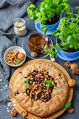 Image showing Homemade currant pie and a cup of green tea.