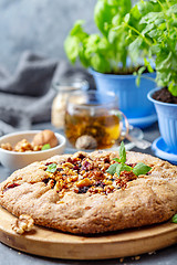 Image showing Homemade galette pie with currants and walnuts.