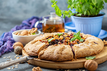 Image showing Galette pie with black currant for breakfast.