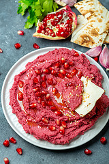 Image showing Homemade traditional beetroot hummus.