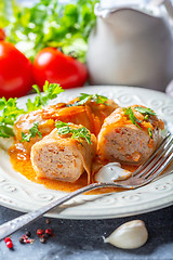 Image showing Cabbage rolls stuffed with ground beef and rice.