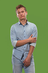 Image showing Beautiful bored man bored isolated on green background